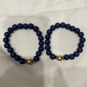 Blue bead bracelets with gold accent bead.